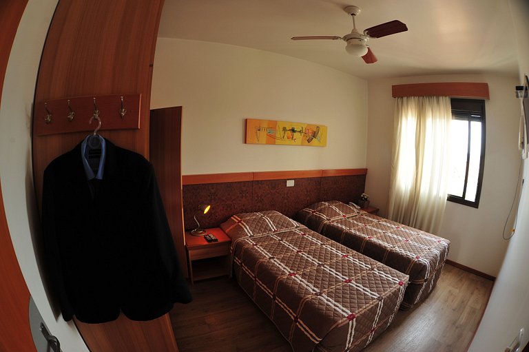 Apartamentos de um quarto com camas de solteiro
